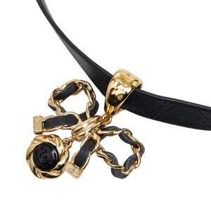 CHANEL Black and Gold Bow Pendant Necklace
